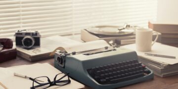Writer and journalist vintage desktop with typewriter