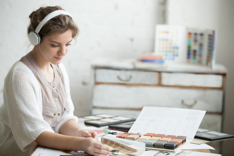 Young woman in headphones at work