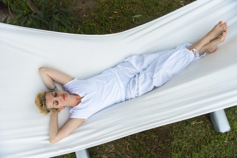 young woman resting on hammock