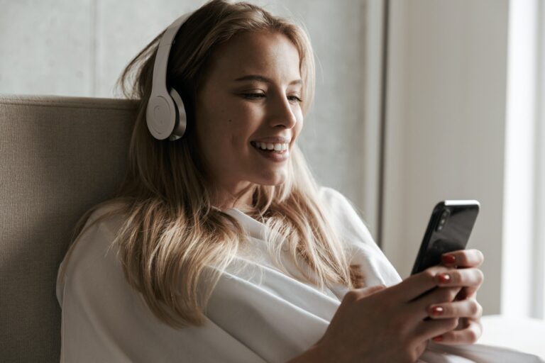 Smiling young woman in headphones