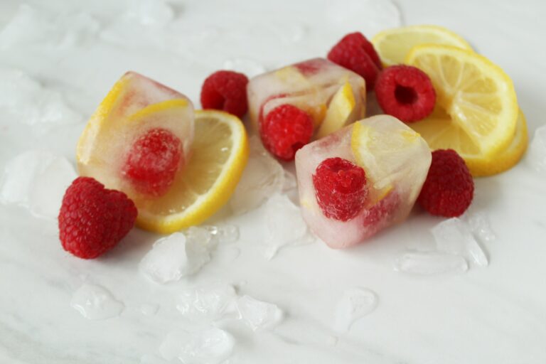 Raspberries and lemons fruit infused ice cubes.