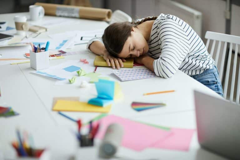 Tired Student Sleeping on Desk