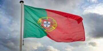 Portugal flag waving against cloudy sky