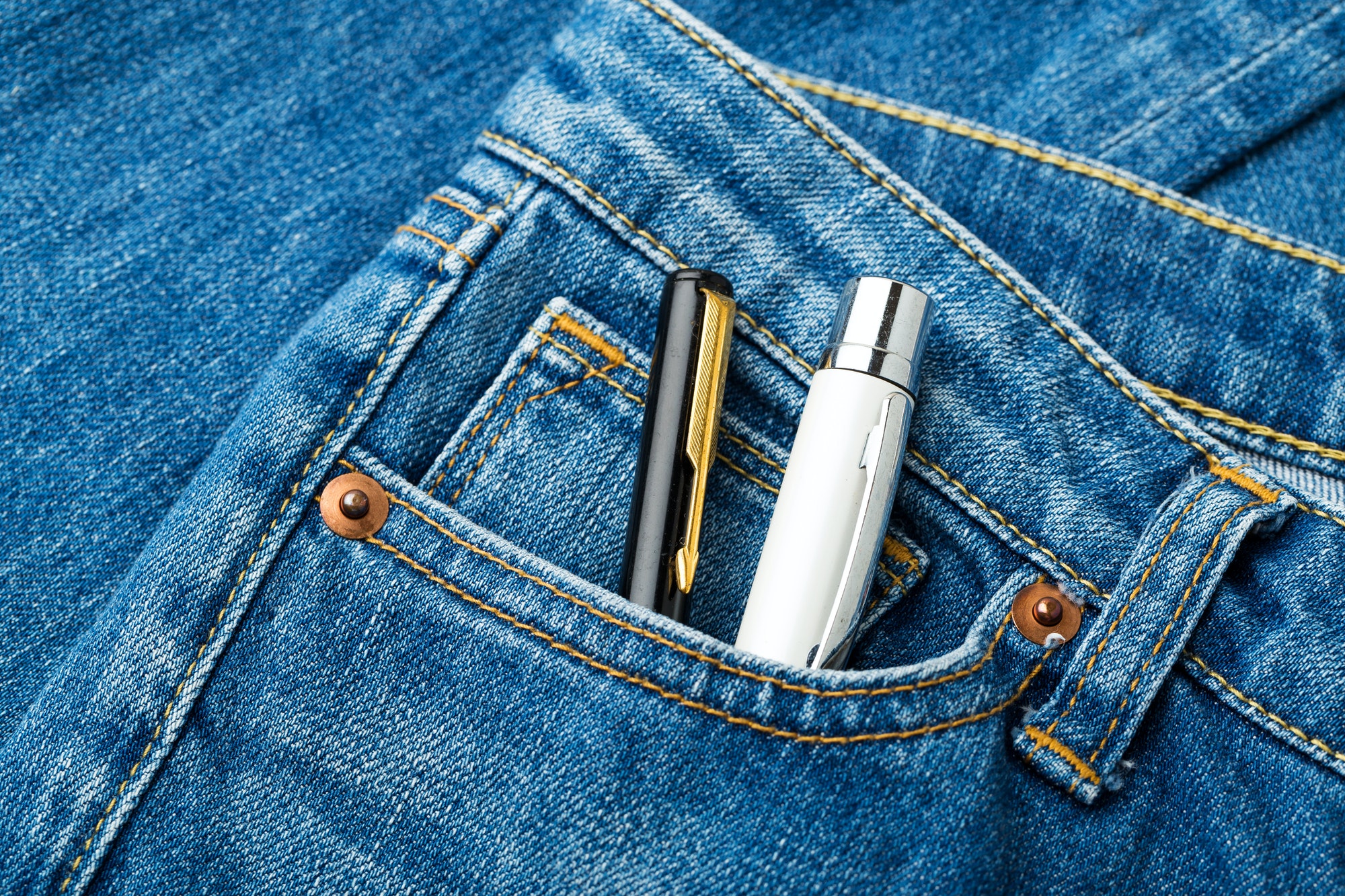 blue jean pocket with two pen