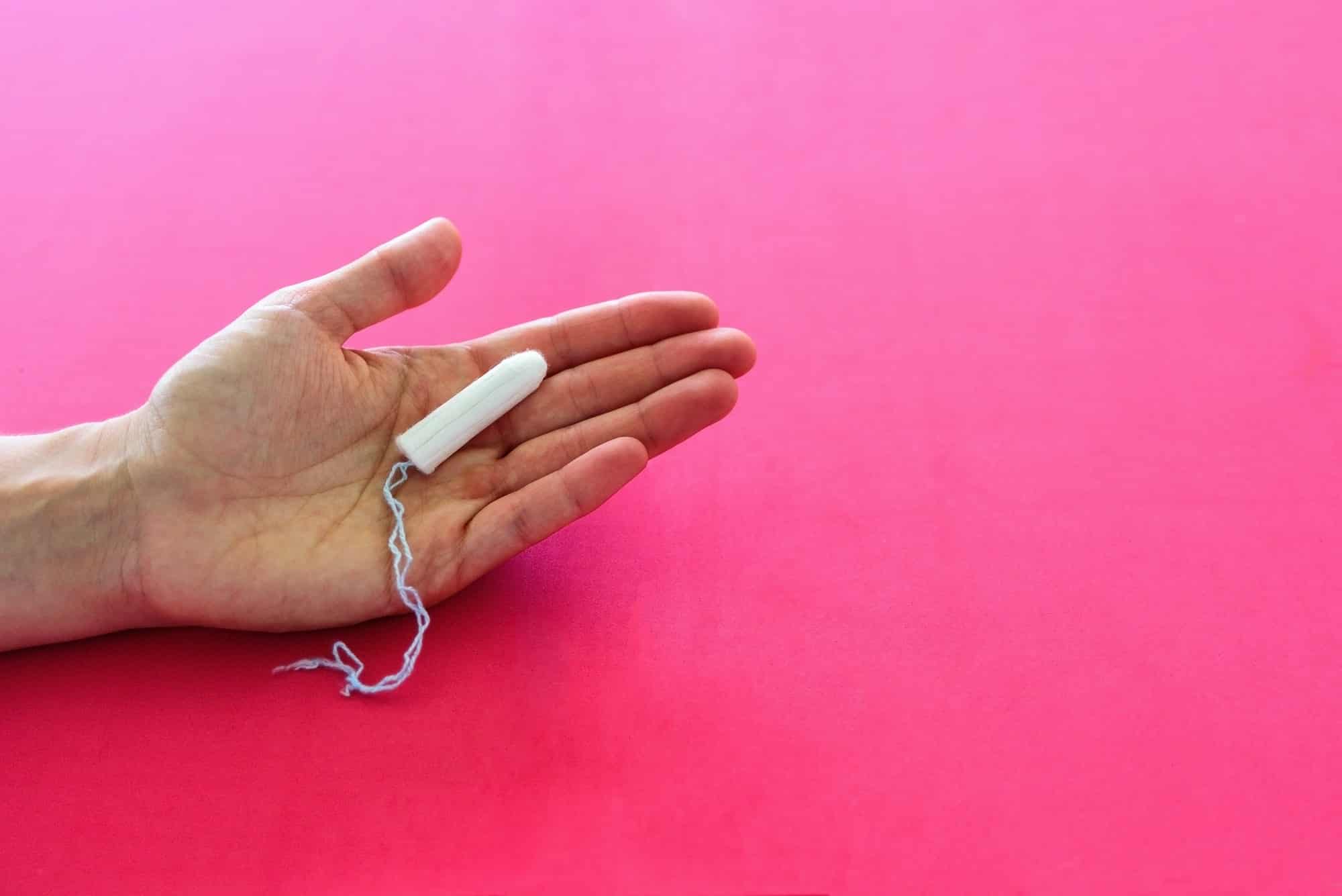 hygienic tampon for women on pink background