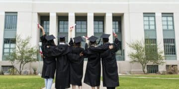 University students in graduation gowns