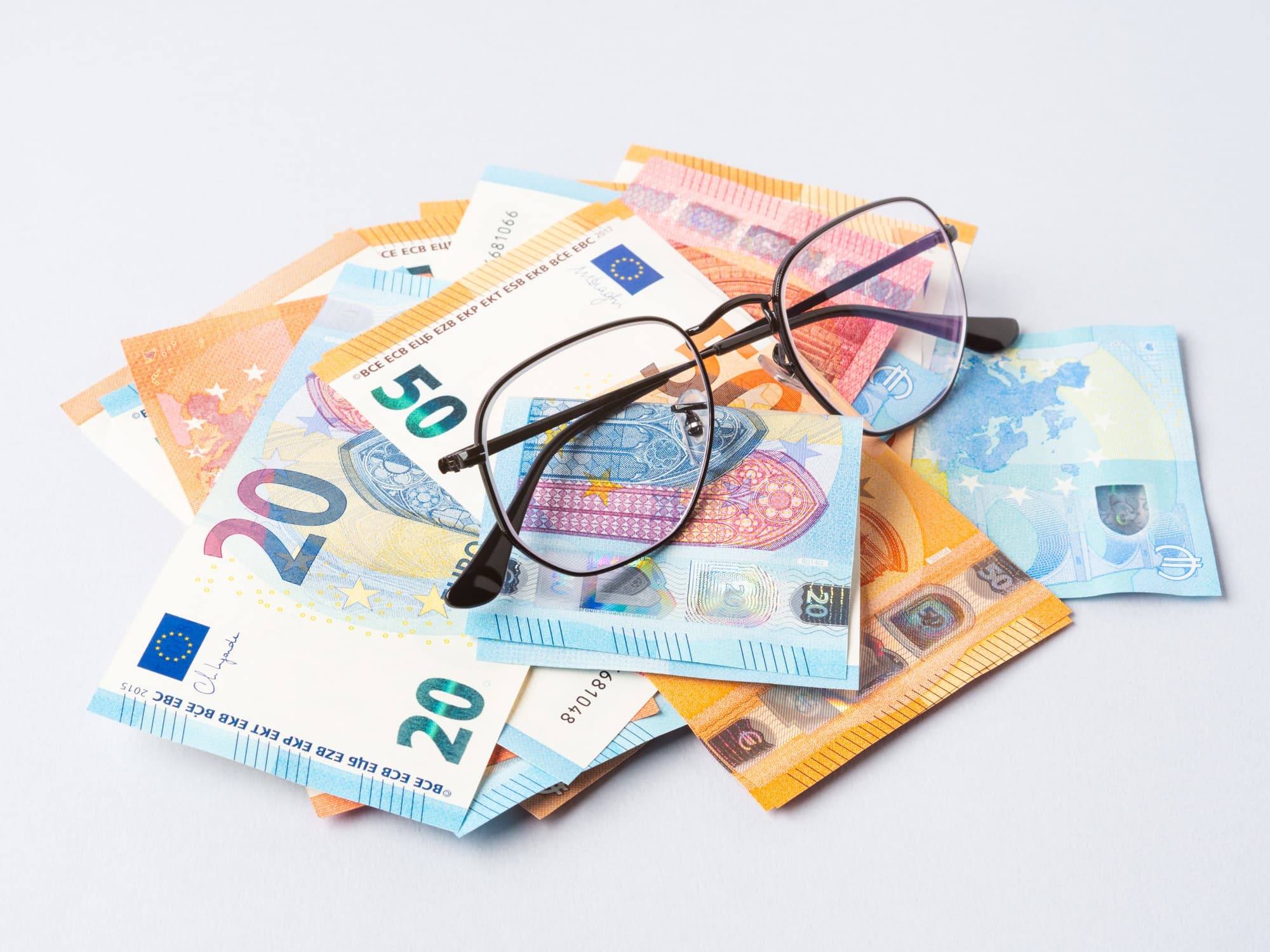 euro money banknotes and glasses online banking business student loan concept