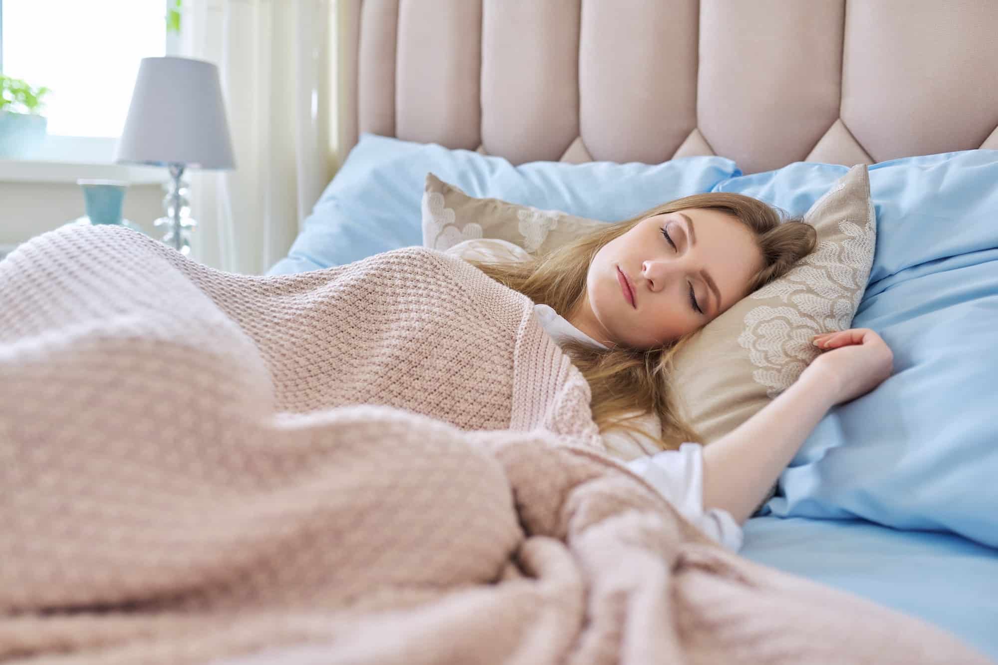 sleeping young woman healthy daytime sleep on pillow with closed eyes