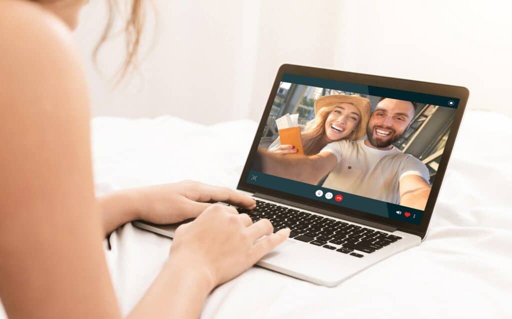 Unrecognizable woman having video conference with her friends