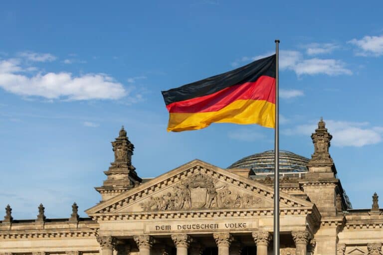 german flag in front of the german parliament bundestag reichstag building berlin germany