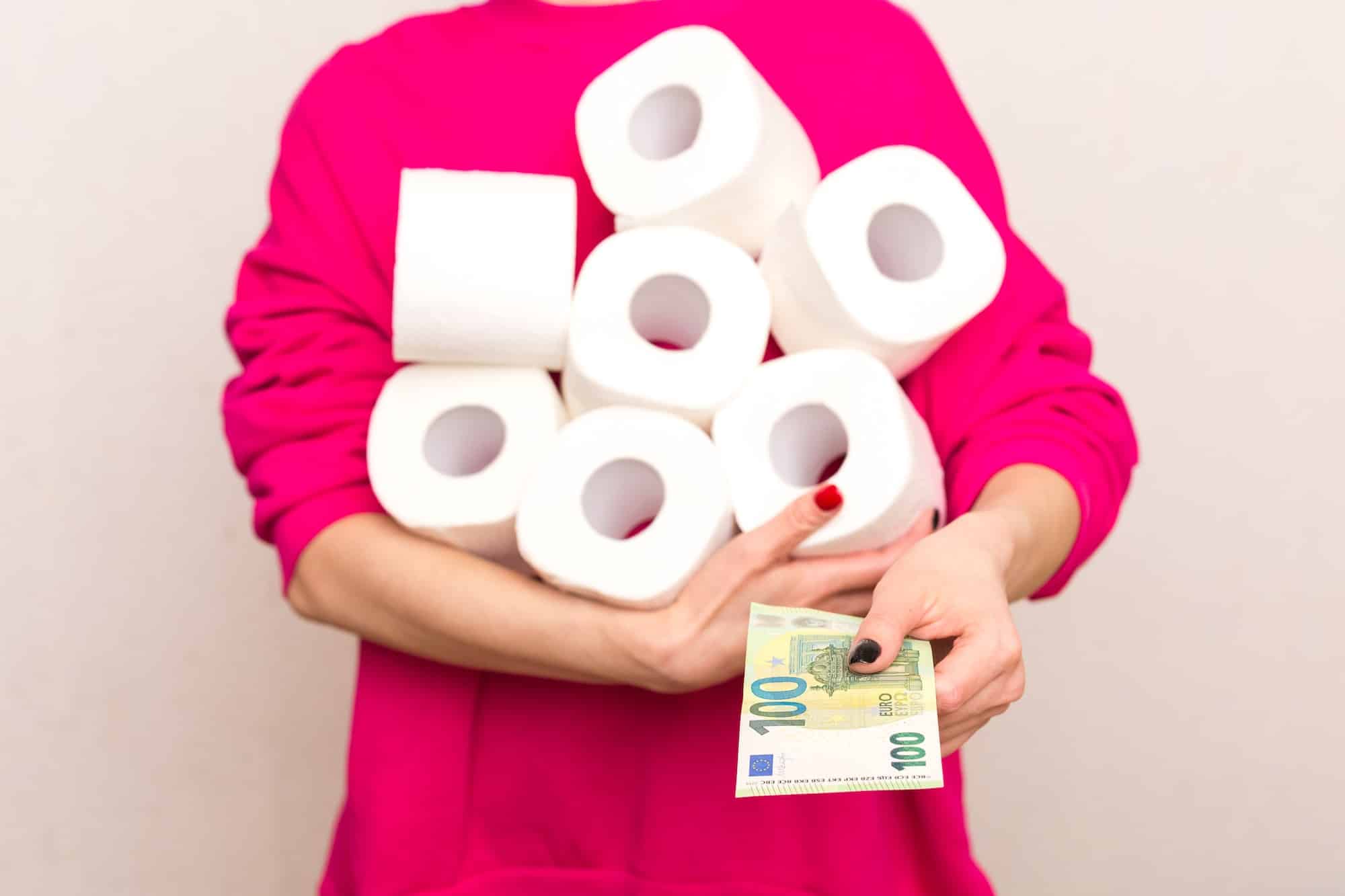 woman holding toilet paper woman buys toilet paper