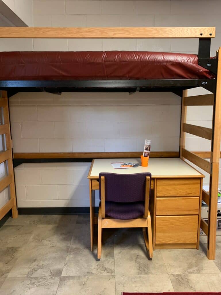 college dorm on move in day loft bed desk under bed are common for small college dorms