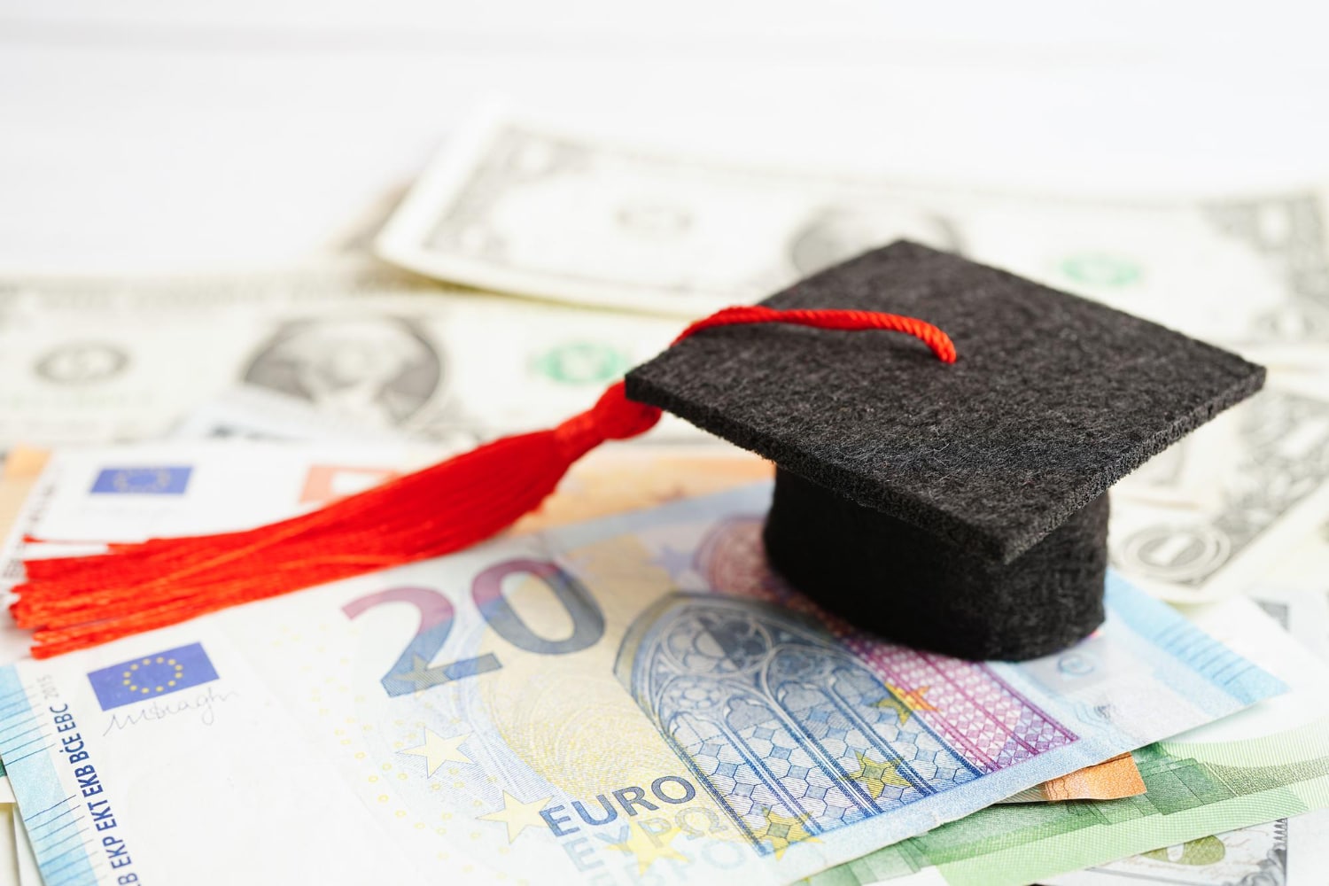graduation gap hat euro us dollar banknotes money education study fee learning teach concept