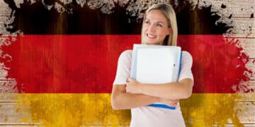 mature student smiling against germany flag grunge effect