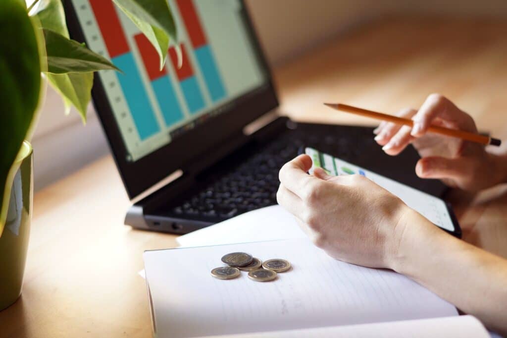 Closeup shot of a woman studying or working from home about finances and savings