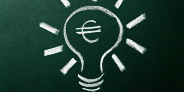 Light bulb as concept of solution for money crisis