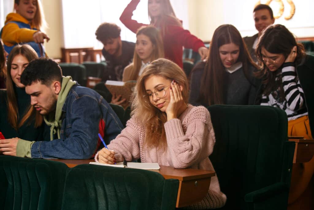 group cheerful happy students sitting lecture hall before lesson