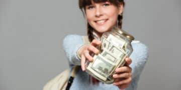 smiling girl with jar full money
