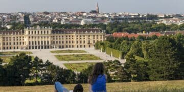 Couple looking at the castle view from the hill in Vienna, Austria