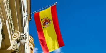 Spanish flag flying at an old building