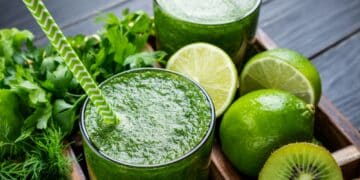 green smoothie with vegetables fruits and herbs healthy smoothie with spinach lime kiwi