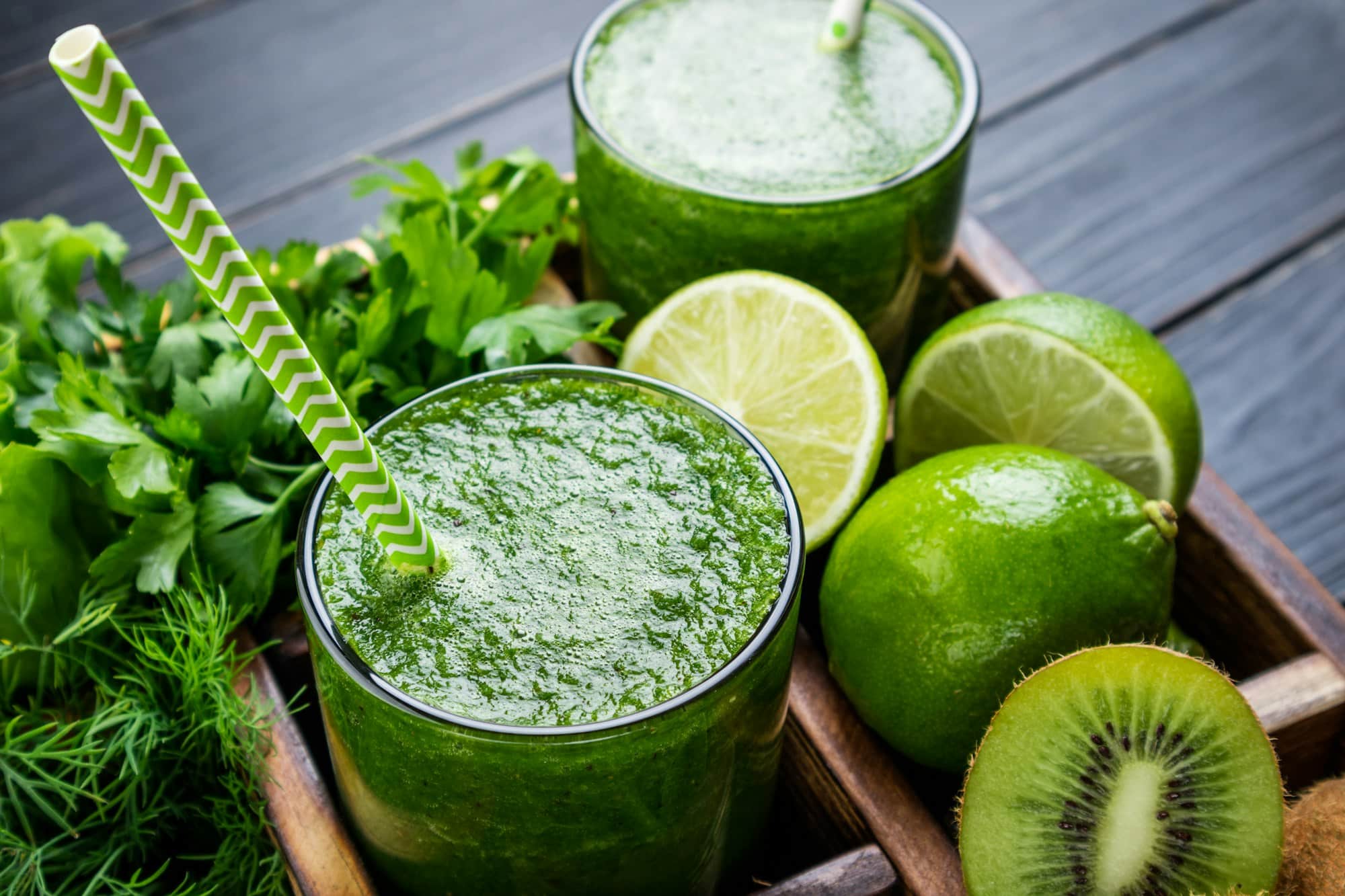 green smoothie with vegetables fruits and herbs healthy smoothie with spinach lime kiwi