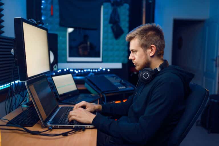 programmer working on laptop computer technology