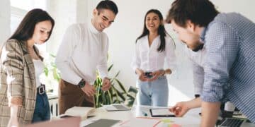 group of happy businesspeople working in office