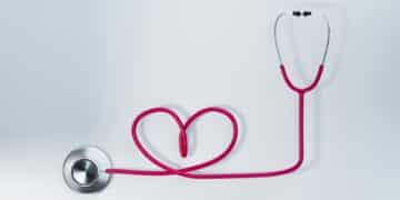 ink heart shape stethoscope on white background